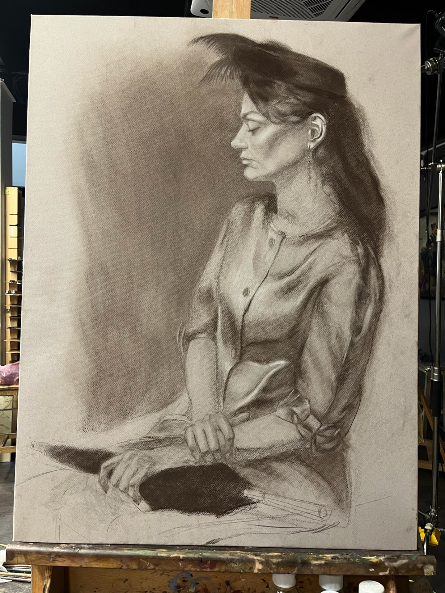 Seated Woman with Hat — Charcoal on paper, 50 × 70 cm